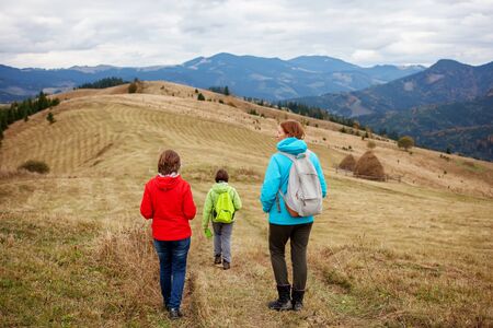 Hiker woman in moumtains in autumnの写真素材