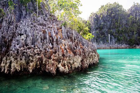 Razor sharp cliffs of islands of Raja Ampat Indonesiaの写真素材