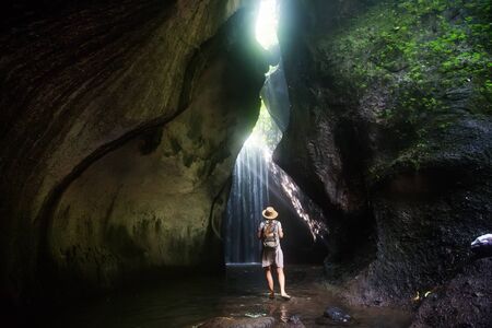 Woman near waterfal on Bali, IndonesiaÂ の写真素材