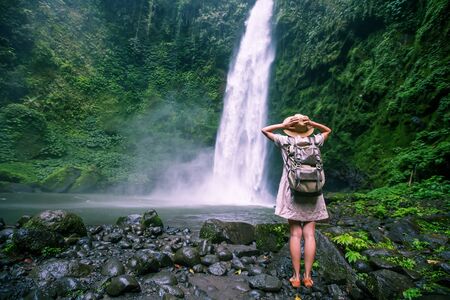 Woman near Nung Nung waterfal on Bali, Indonesiaの写真素材