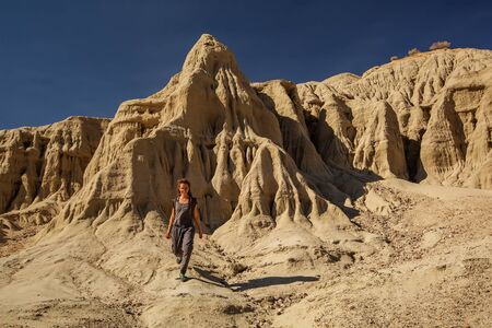 A hiker in the Artist`s Palette landmark place in Death Valley National Park, Geology, sand.の写真素材