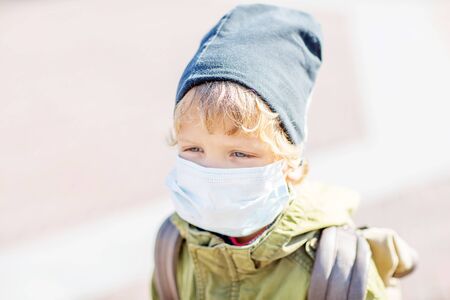 A small boy in protectionÂ mask outdoorの写真素材