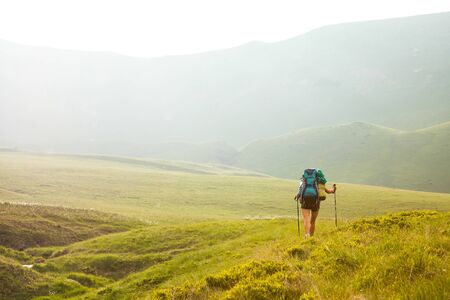 Young people are hiking in Carpathian mountains in summertimeの写真素材