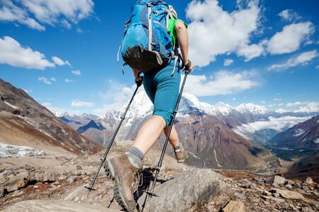 Hiker enjoys the view in the Himalayan mountainsの写真素材