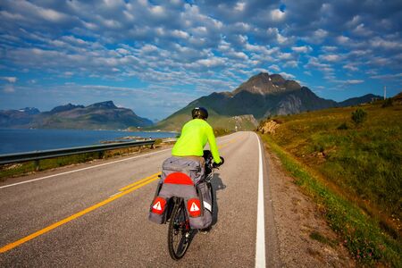 Biking in Norway against picturesque landscape. Bike, active.の写真素材
