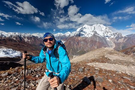 Hiker enjoys the view in the Himalayan mountainsの写真素材