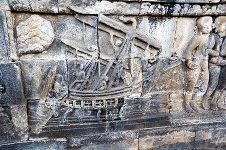 Carvin at the wall of Borobudur temple, Java, Indonesiaの写真素材