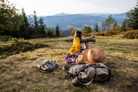 Happy family resting in the mountains in autumnの写真素材