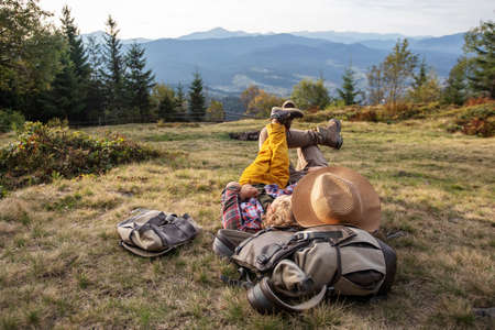 Happy family resting in the mountains in autumnの写真素材