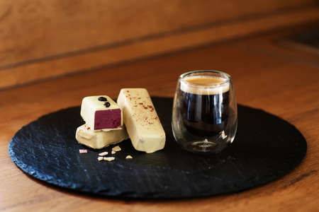 Sweet dessert with coffee at the wooden tableの写真素材