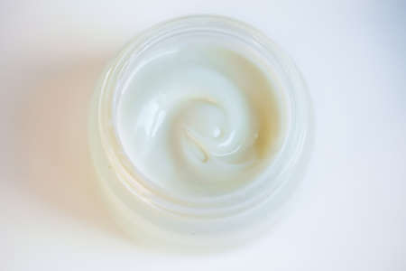 Cream in a jar on a white backgroundの写真素材