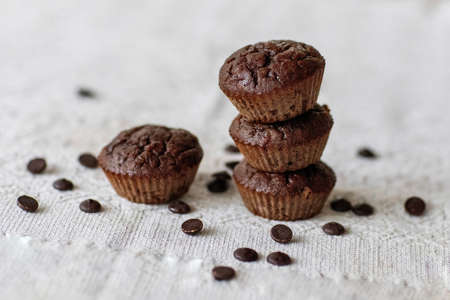 Homemade chocolate muffins on a wooden table