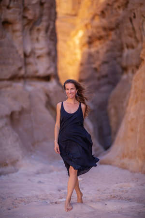 Beautiful woman resting in the desert