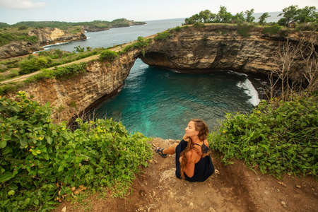 Woman resting on the island of Nusa Penidaの写真素材