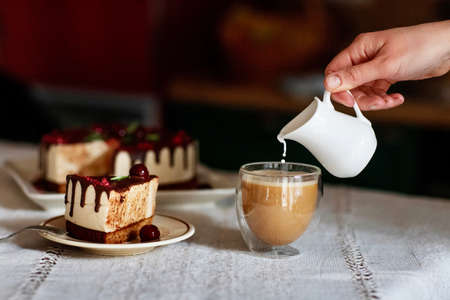 Homemade cheesecake with coffee and milkの写真素材