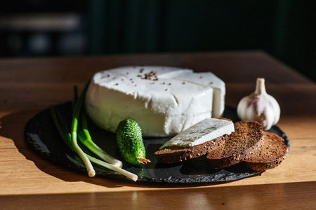 Yummy goat cheese on a wooden tableの写真素材