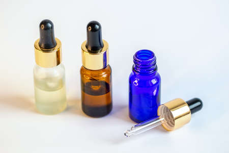 A bottle with a pipette for essential oilsの写真素材