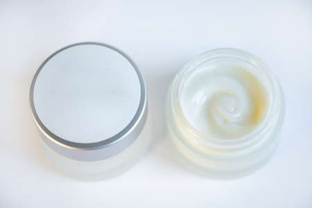 Cream in a jar on a white backgroundの写真素材