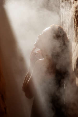 Beautiful woman resting in the desertの写真素材