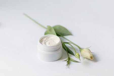 Cream in a jar on a white backgroundの写真素材
