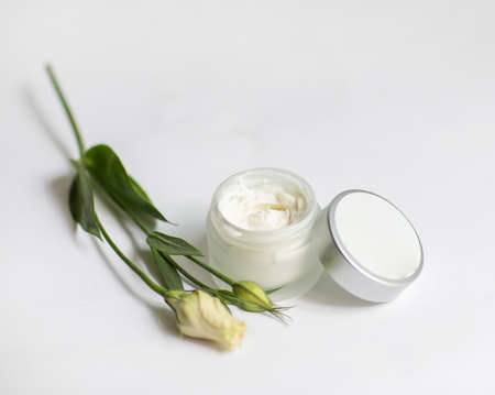 Cream in a jar on a white backgroundの写真素材