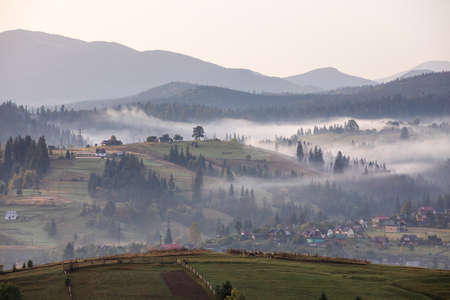 Magic dawn in the misty mountainsの写真素材
