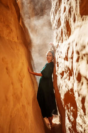 Beautiful woman resting in the desertの写真素材