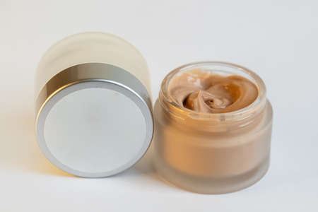 Cream in a jar on a white backgroundの写真素材