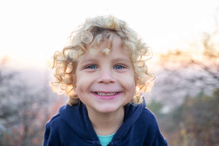 Portrait of a boy at sunsetの写真素材