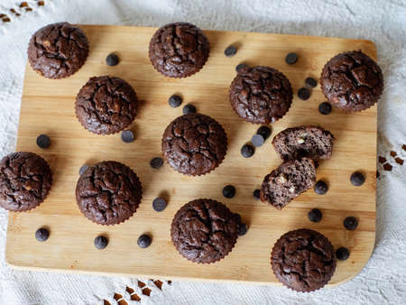 Homemade chocolate muffins on a wooden tableの写真素材