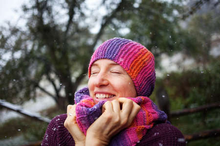 Happy woman in the snowの写真素材