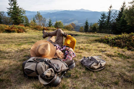 Happy family resting in the mountains in autumnの写真素材