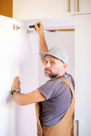 Carpenter makes furniture in the roomの写真素材