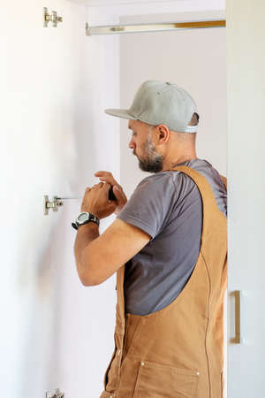 Carpenter makes furniture in the roomの写真素材