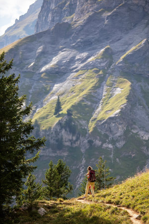 Mother with her son in the mountains in Switzerland on Lake Oeschinenseeの写真素材