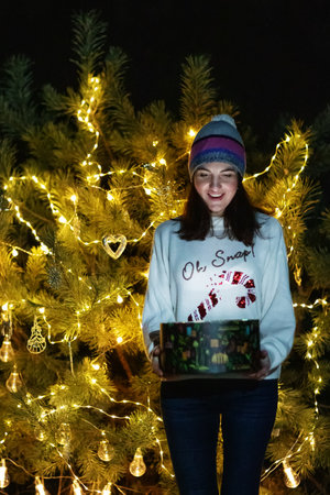 Happy family in the forest near the Christmas treeの写真素材