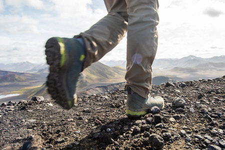 Tourist hiking in Landmanloer Park in Iceland