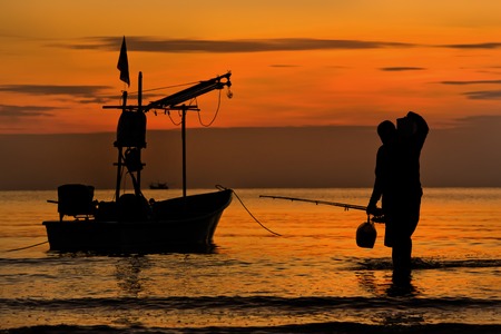 huahin thailand fisherman back from fishing at seaの写真素材