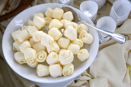 Butter curls in a white bowlの写真素材