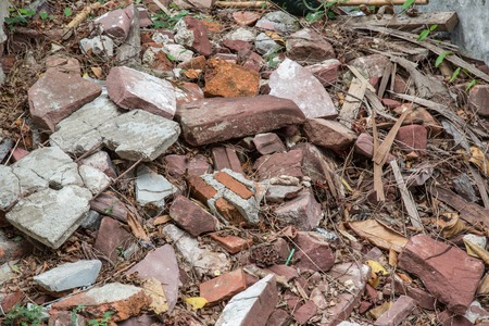 background of old destroyed bricks to pile upの写真素材