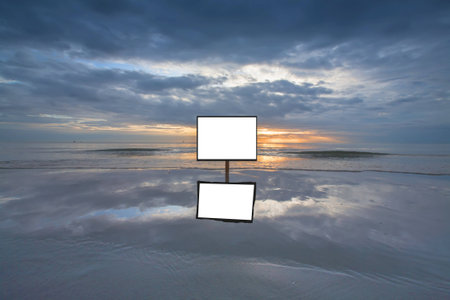 Blank advertising post at the beachの写真素材