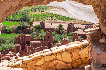 image behind a wall of the Kasbah Ait Ben Haddou in Moroccoの写真素材