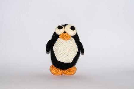 stuffed penguin made ââof wool with white backgroundの写真素材
