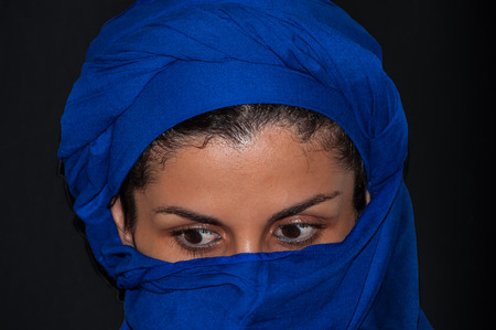 portrait muslim woman with blue scarf isolatedの写真素材