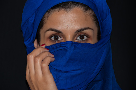 portrait muslim woman with blue scarf isolatedの写真素材