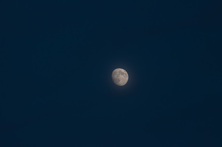 image of the moon on blue sky background