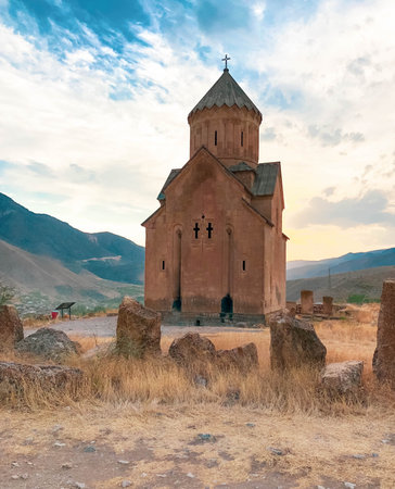 Little medieval church on top of a mountain with old grave stones. Areni, Armenia.の写真素材