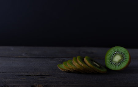 Kiwi fruit on wooden background with copy spaceの写真素材