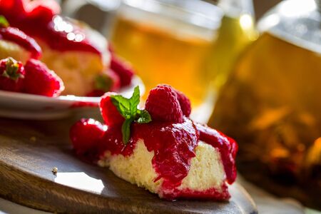 Japan cotton cheescake with raspberry sauce and green teaの写真素材