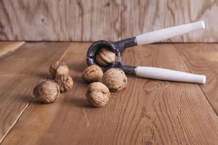 Walnut on wooden table. Healthy food and snack.